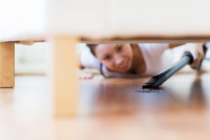 spring cleaning under furniture